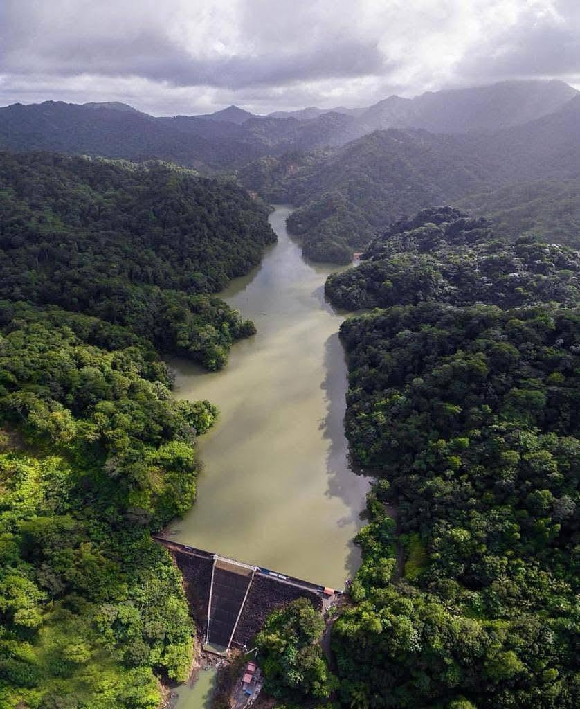 John Compton Dam reservoir surrounded by green hills in Saint Lucia.